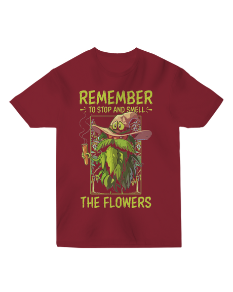 "White ‘Remember to Stop and Smell’ t-shirt with abstract daisy graphic, modeled in a sunflower field for nature-inspired humor"